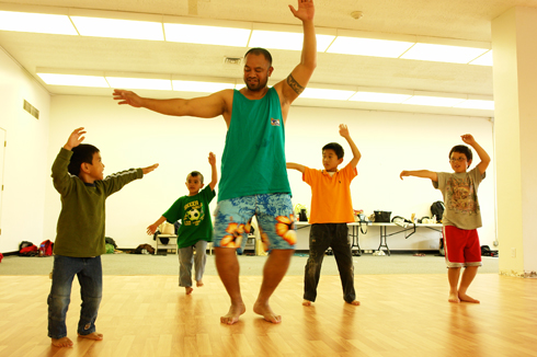 Boys learning from their Tahitian dance instructor